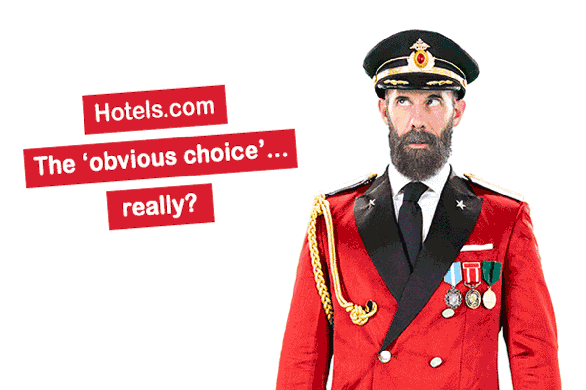 Hotels.com mascot Captain Obvious looks down in shame after claiming that Hotels.com is the 'obvious choice'