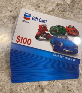 Stack of $100 Chevron gift cards for gas
