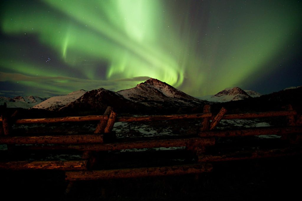 Northern lights image above the mountains in Alaska