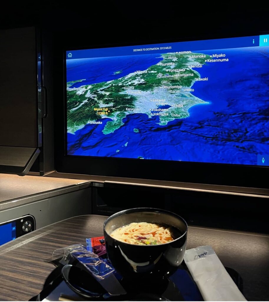 ana the room business class ramen with flight map
