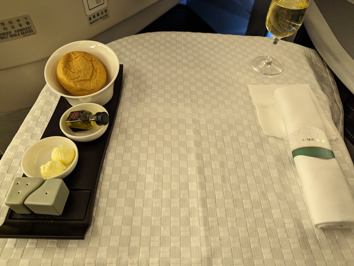 eva air business class dinner table set with bread