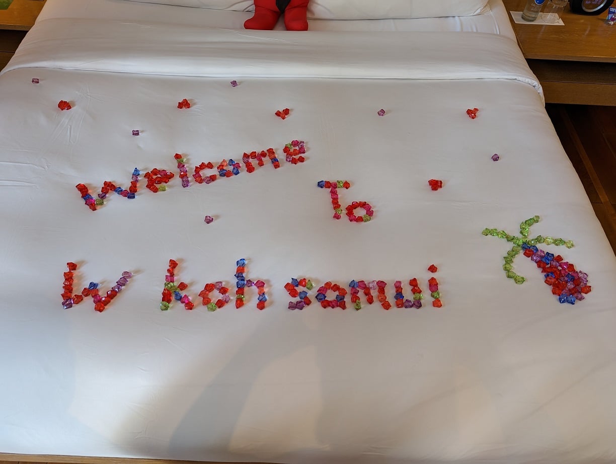 w koh samui ocean front haven bed with welcome message