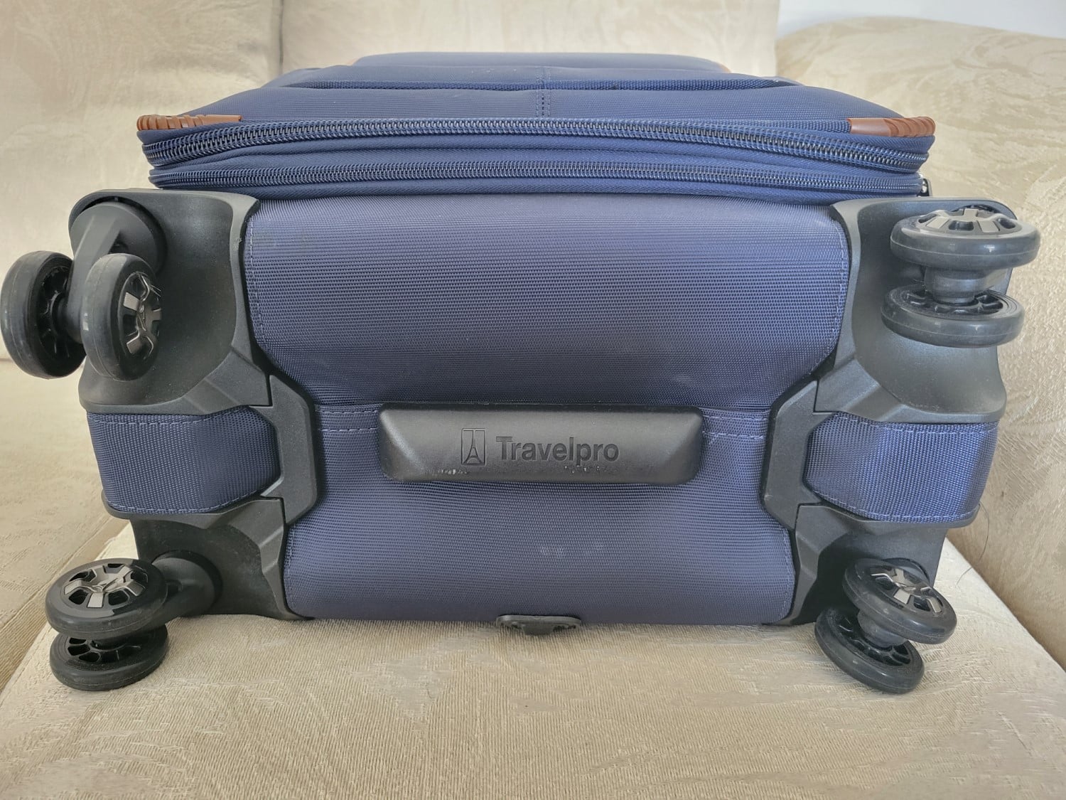 Travelpro Crew VersaPack Max Carry-On Expandable Spinner Wheels Underside of Bag