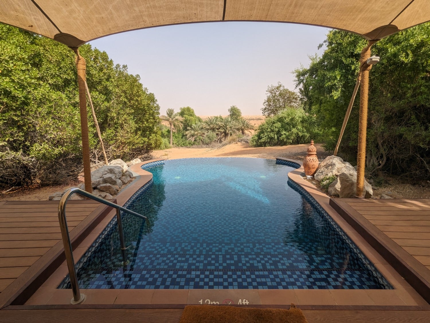 View overlooking the desert and private plunge pool from the Bedouin suite at Al Maha resort.