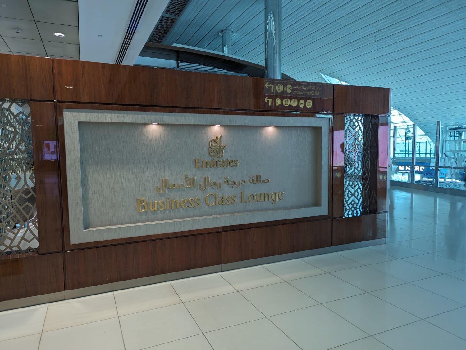 Sign for entry to the Emirates business class lounge in Dubai International Airport.