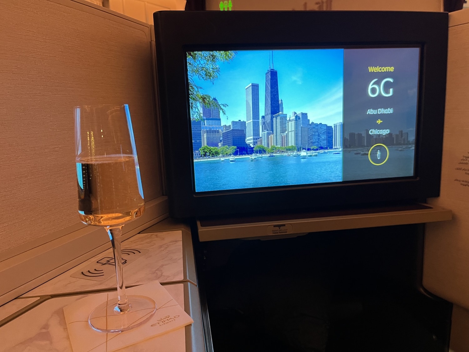 etihad airways business class a350 entertainment console with champagne