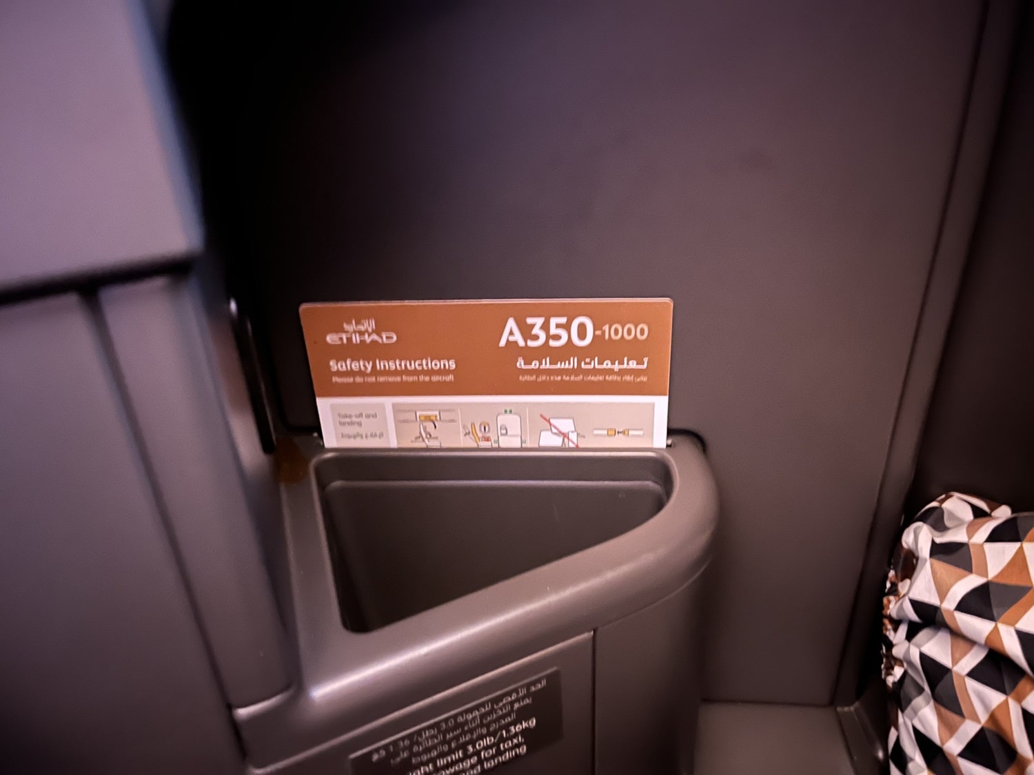 etihad airways business class a350 seat storage with safety card