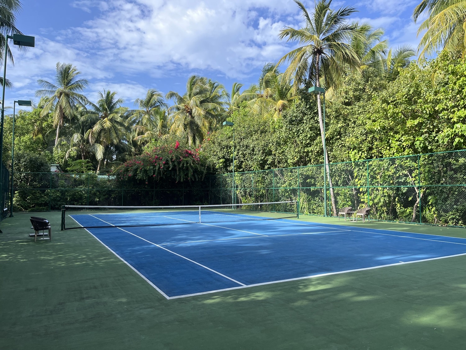 st regis maldives vommuli resort tennis court