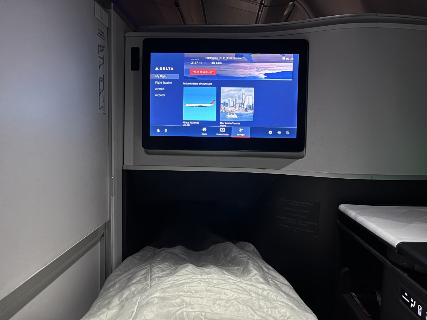 delta one business class bed while lying down