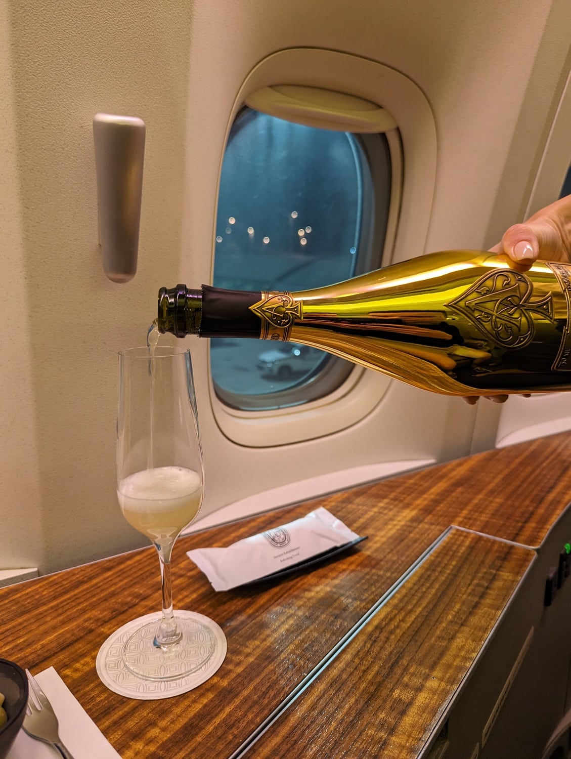 qatar airways first class 777-300er armand de brignac champagne pour