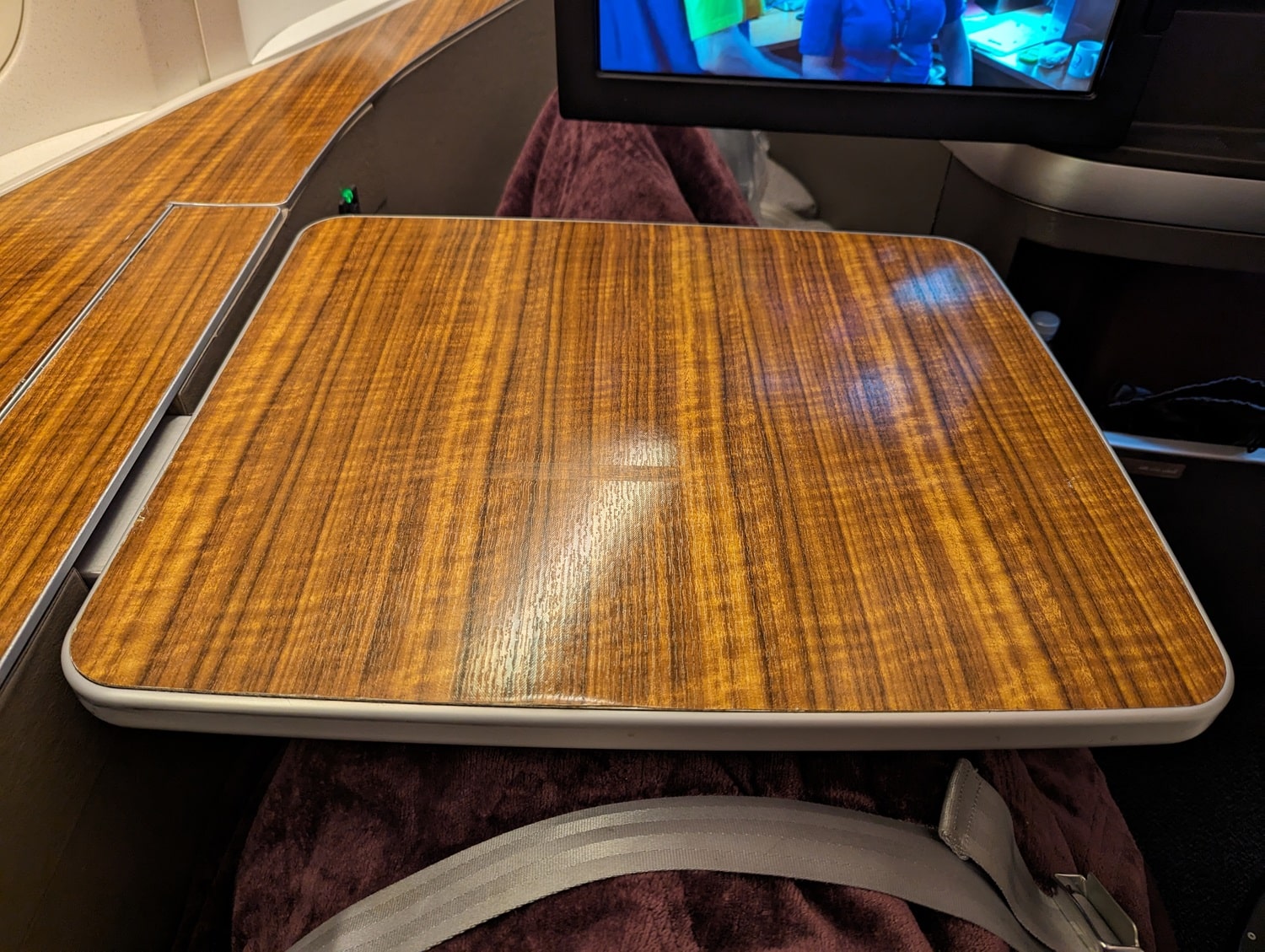 qatar airways first class 777-300er tray table extended