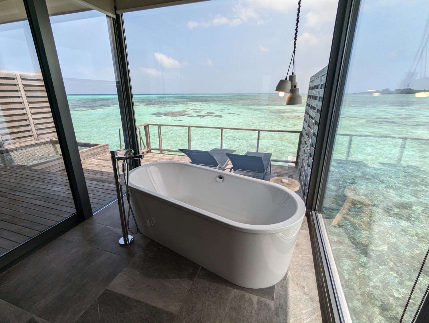 le meridien maldives resort sunrise overwater one bedroom villa bathtub