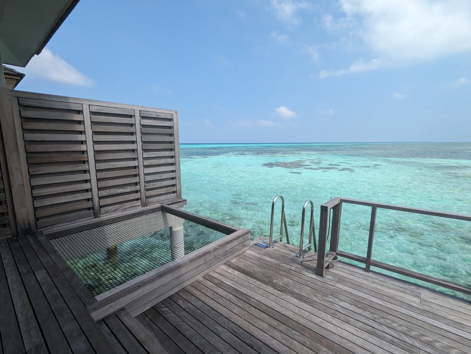 le meridien maldives resort sunrise overwater one bedroom villa hammock and ladder