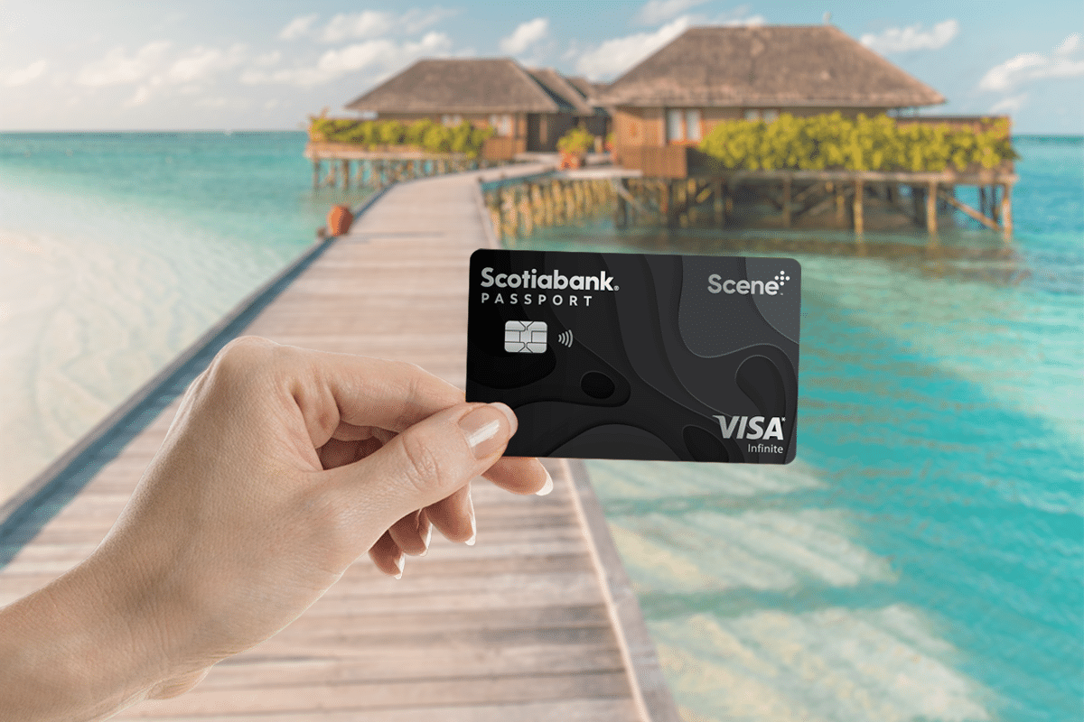 scotia-passport-visa-infinite-review-hand-holding-credit-card-featured