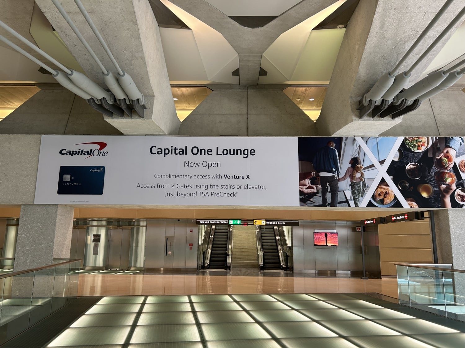 capital one lounge promotion banner in terminal at iad