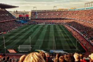 how to save money on sporting event travel with miles and points featured image