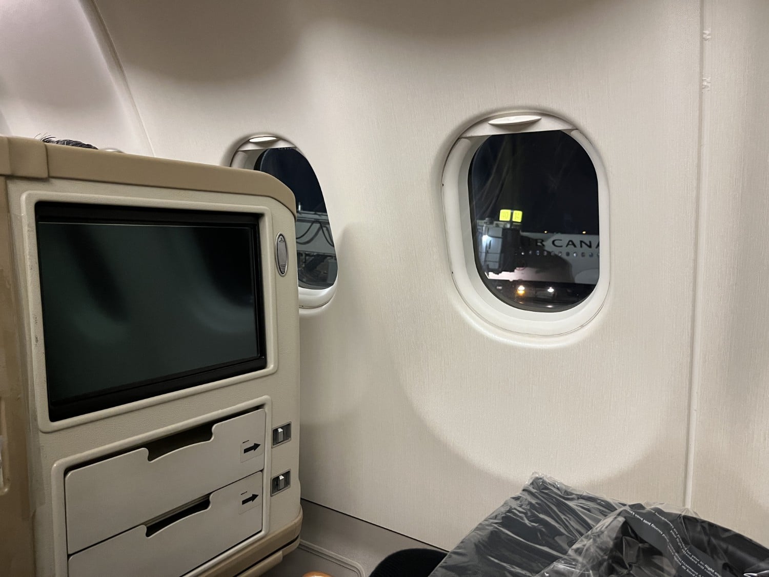 air canada a330 business class entertainment console with window
