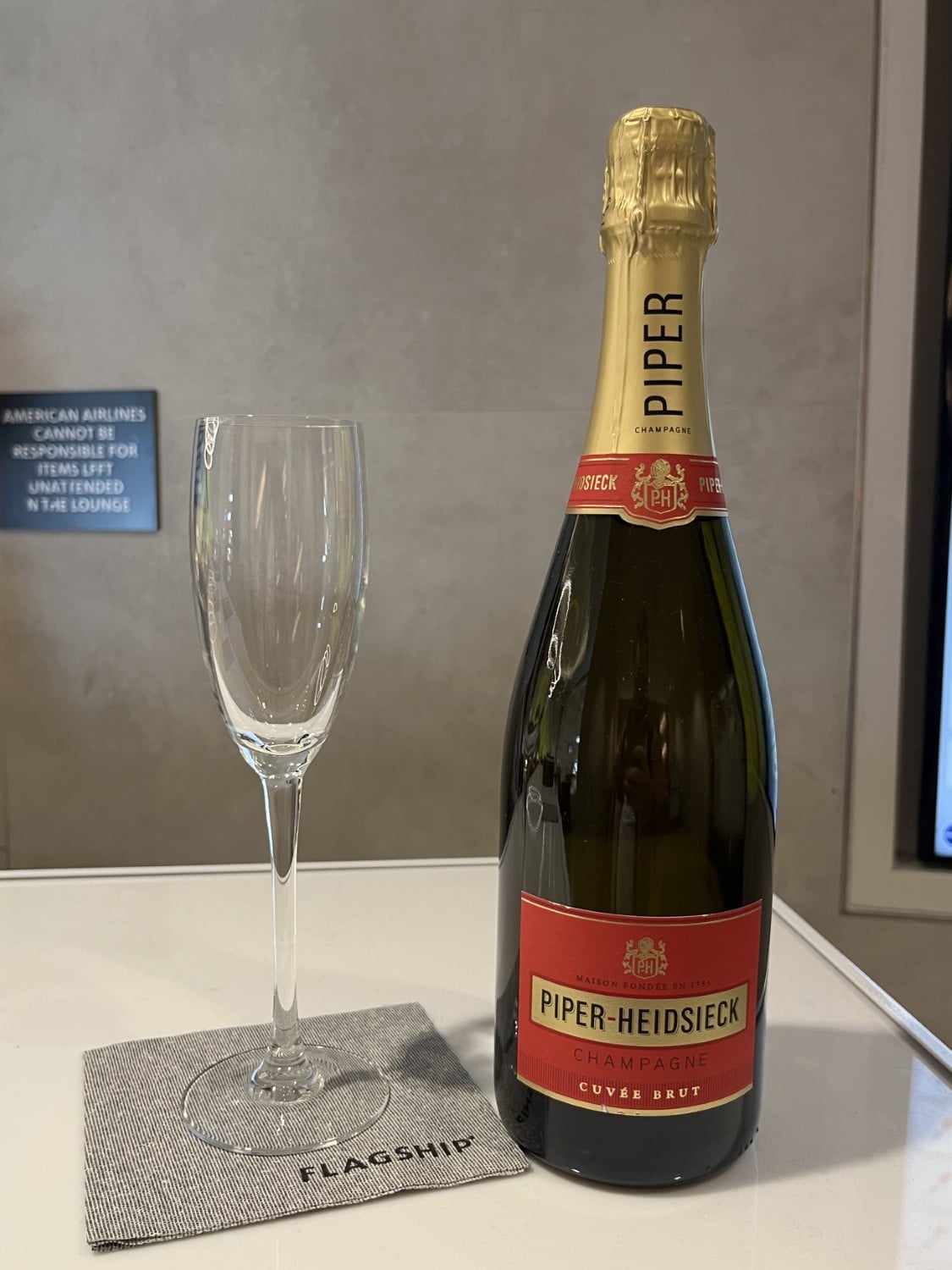 lax american airlines flagship lounge champagne with glass
