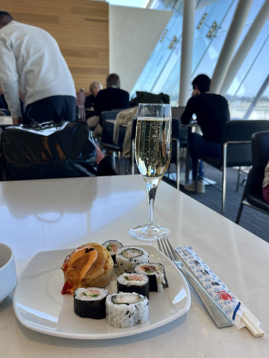 lax american airlines flagship lounge sushi with champagne