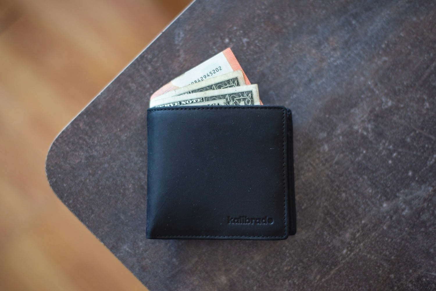 wallet on desk with money