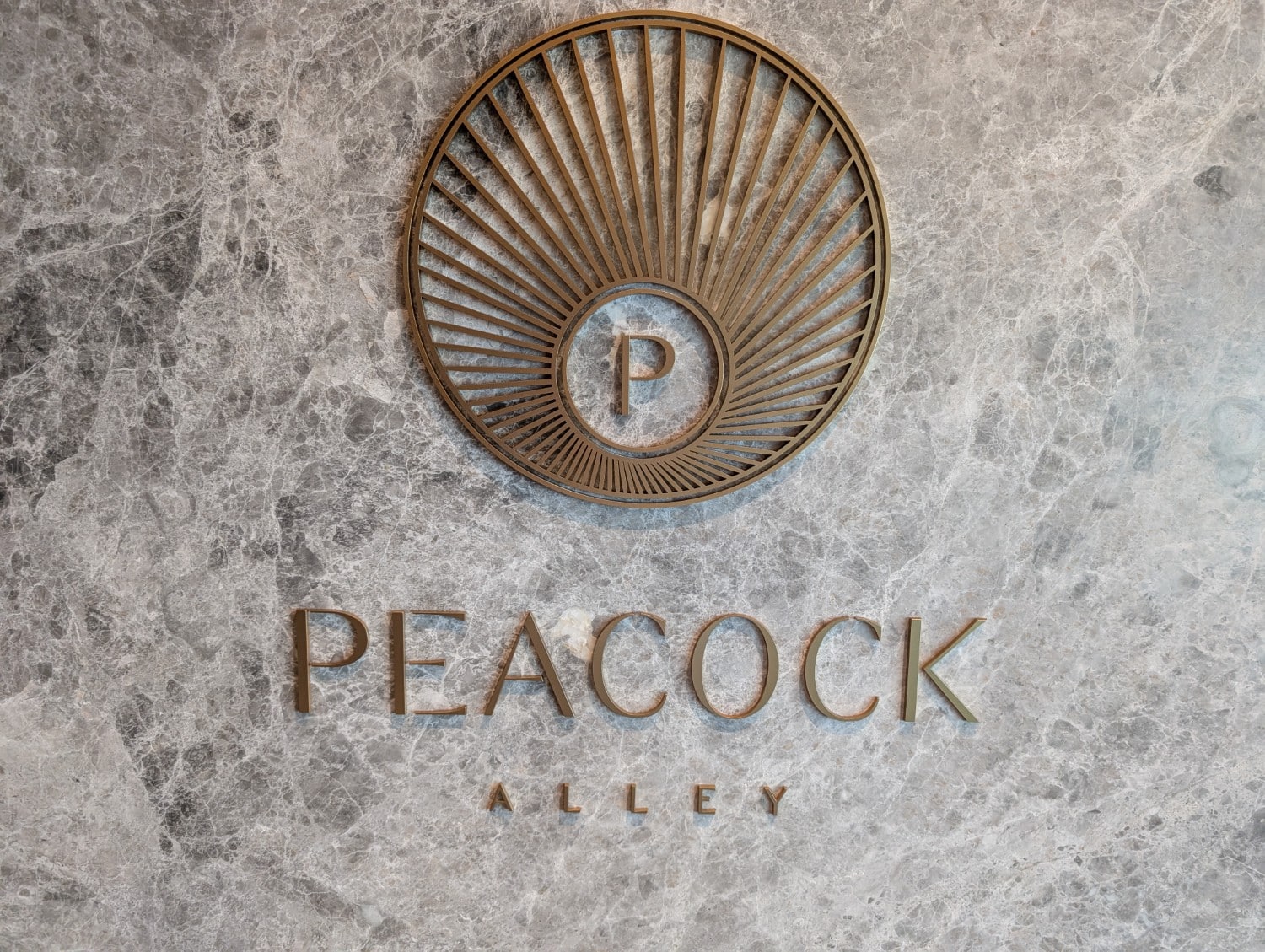 waldorf astoria osaka peacock alley sign