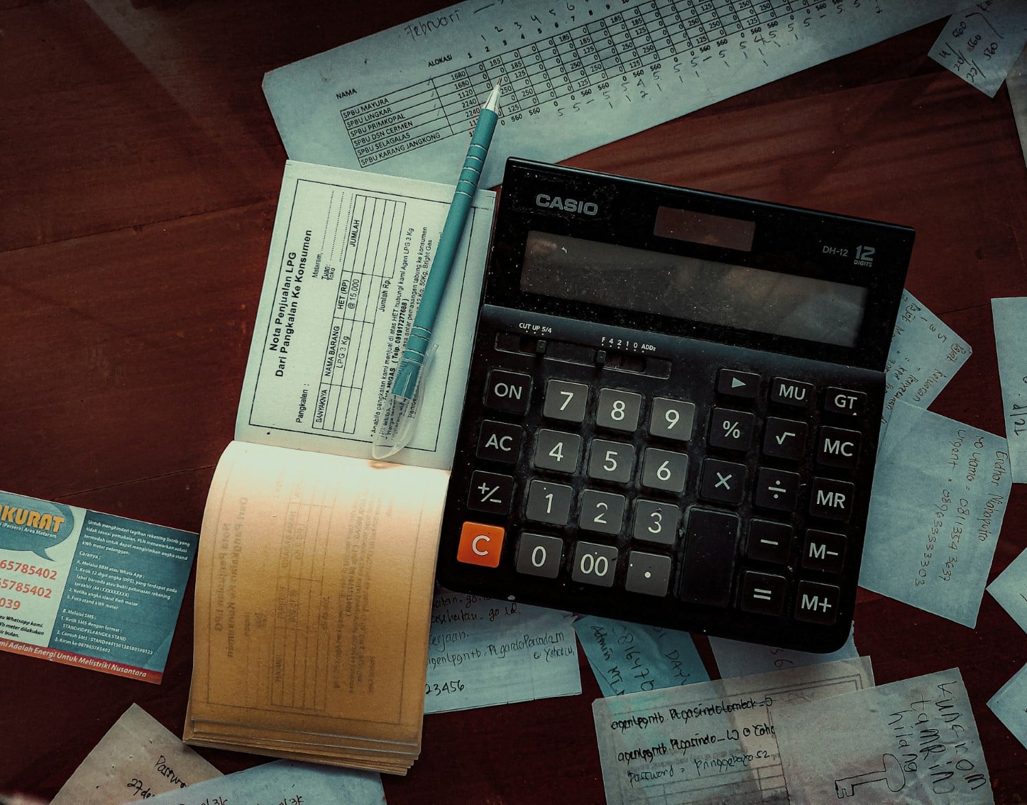bills on desk with a calculator