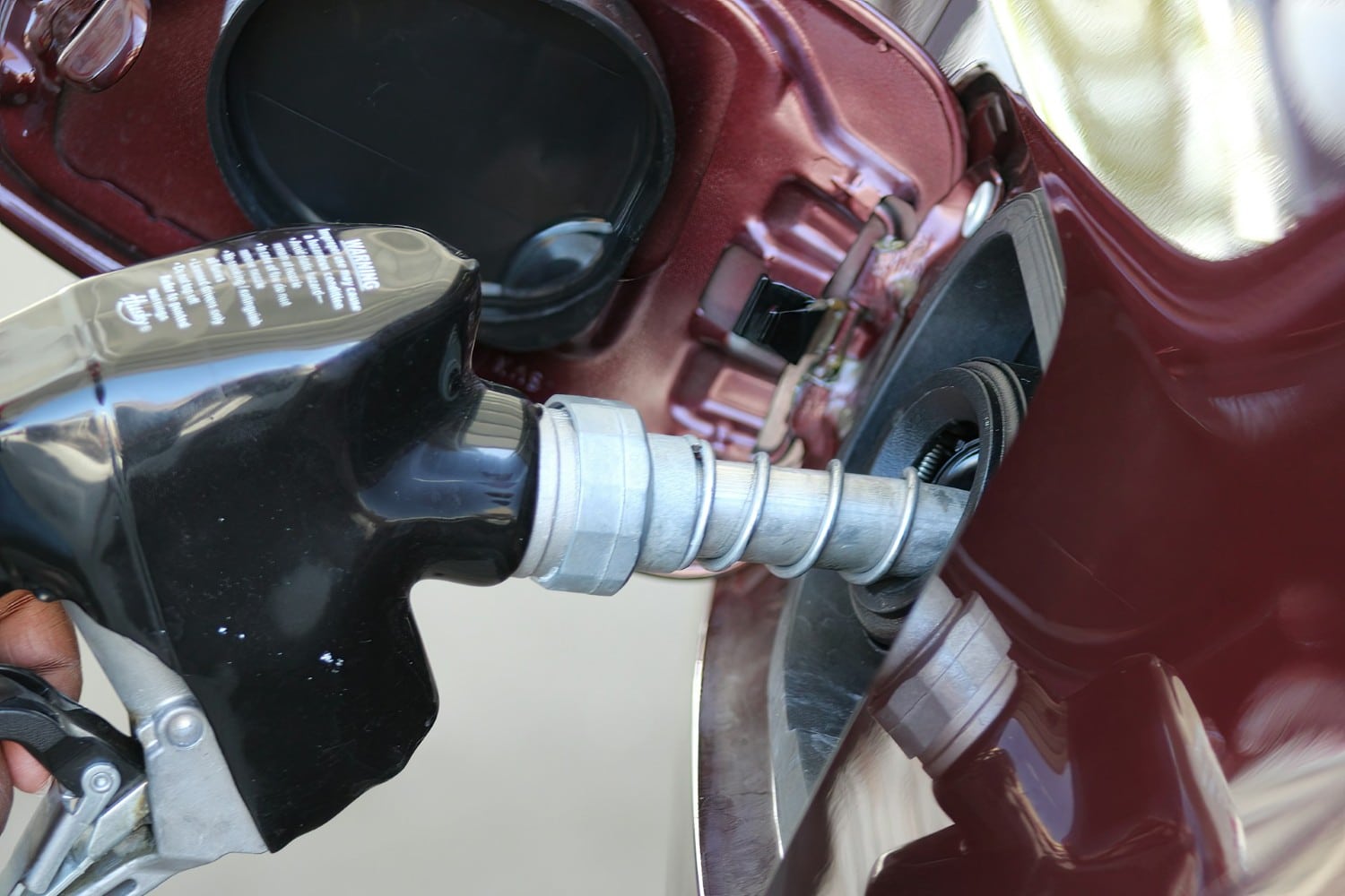 car being fueled at gas station