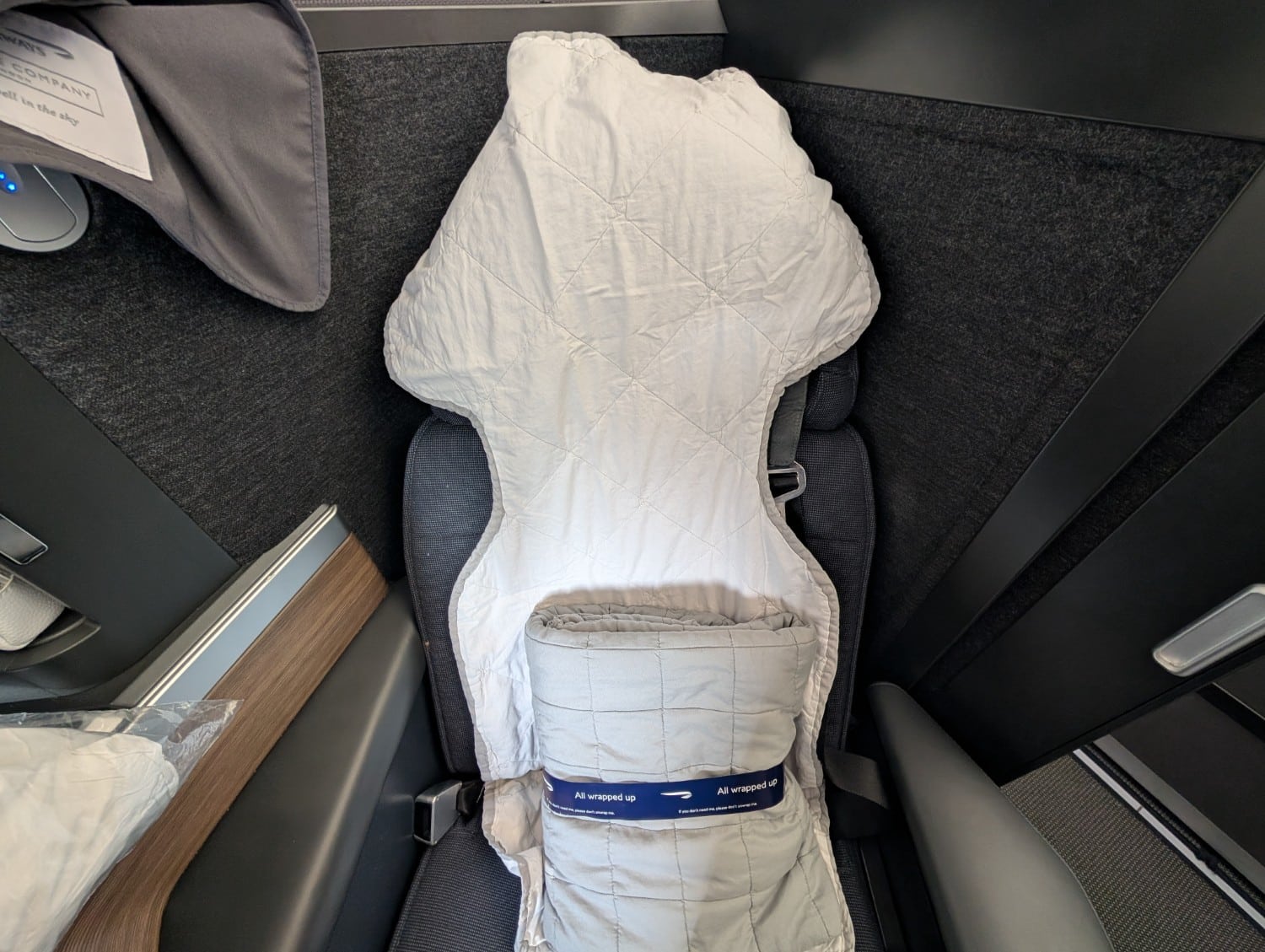british airways business class a350 seat with mattress pad and blanket