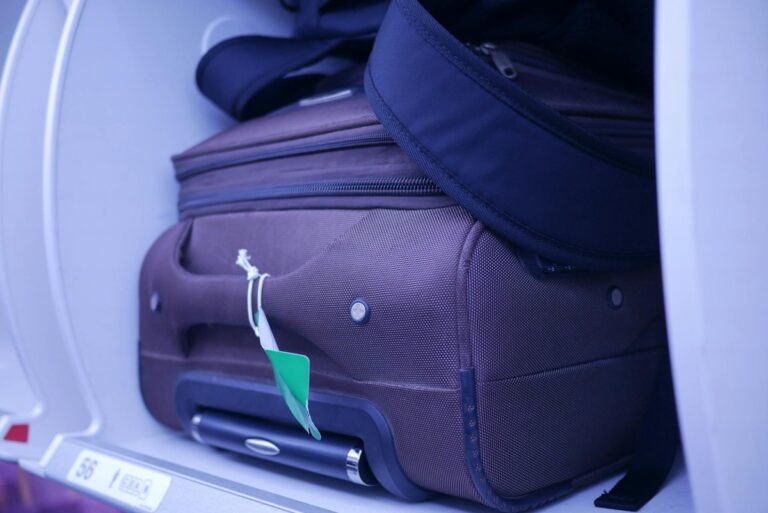 carry on luggage stowed in overhead bin