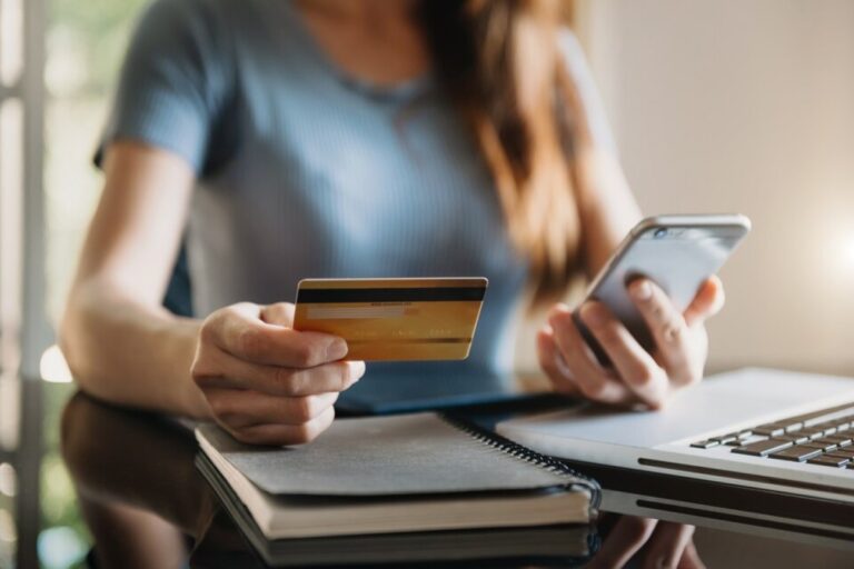credit card second year bonus girl holding card featured image