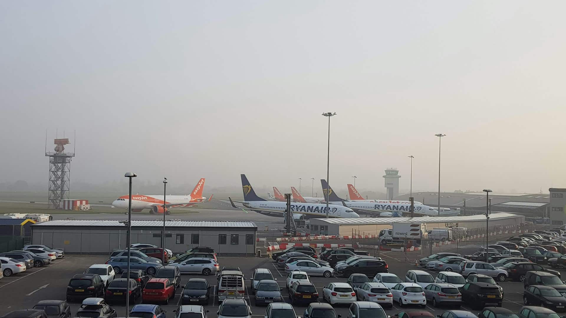 airport parking with airplanes in background