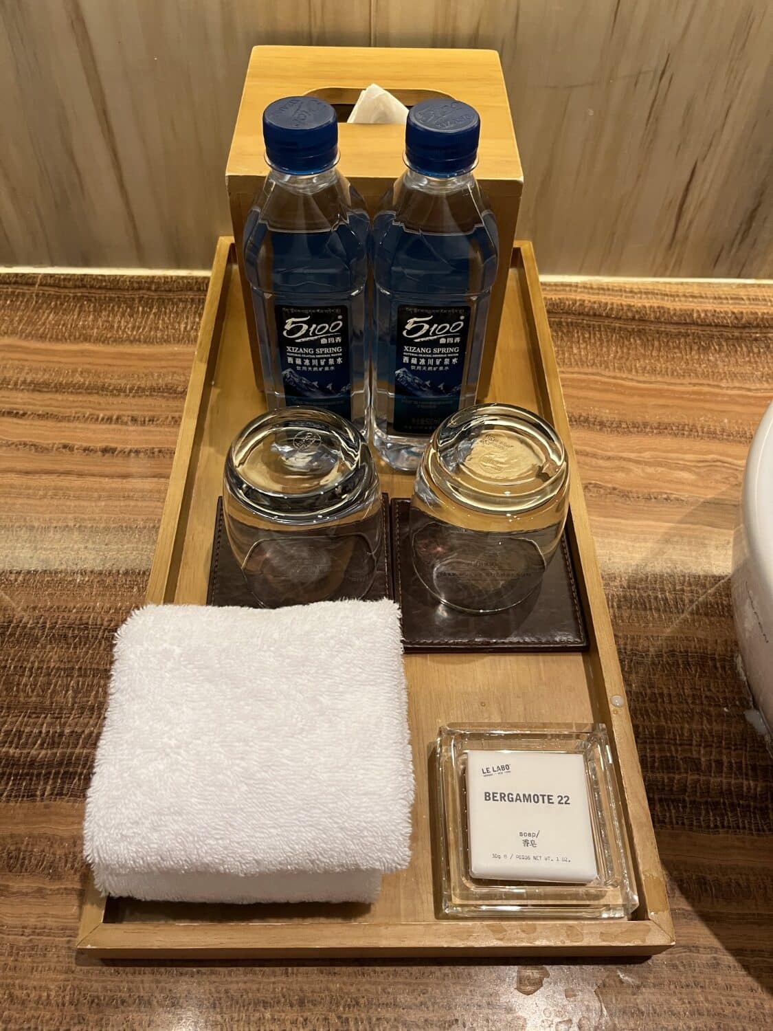 park hyatt guangzhou king bed park view bathroom glassware and water