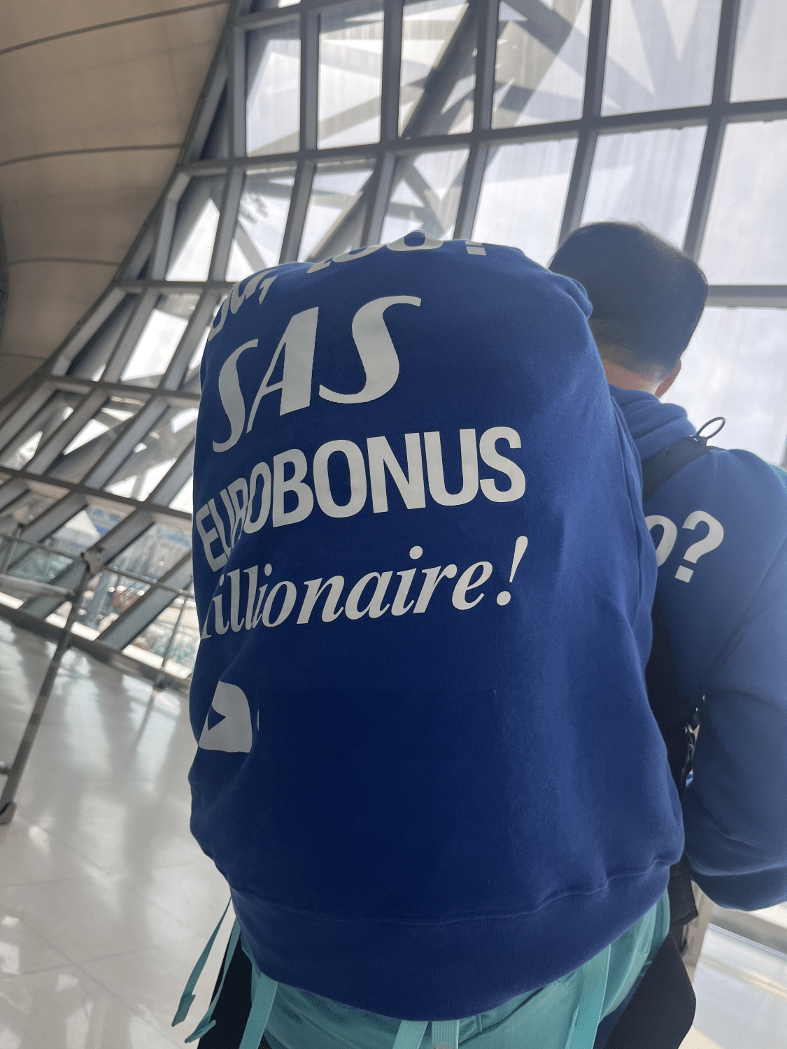 sas millionare participant at airport