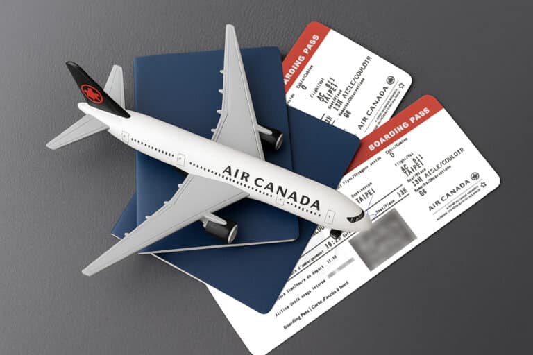 air canada model plane on two air canada boarding passes