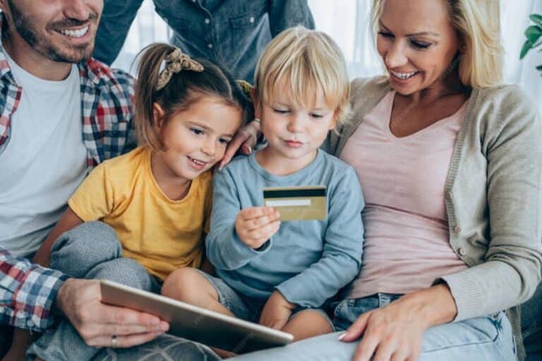 cheerful family shopping online credit card managing finances miles points for families