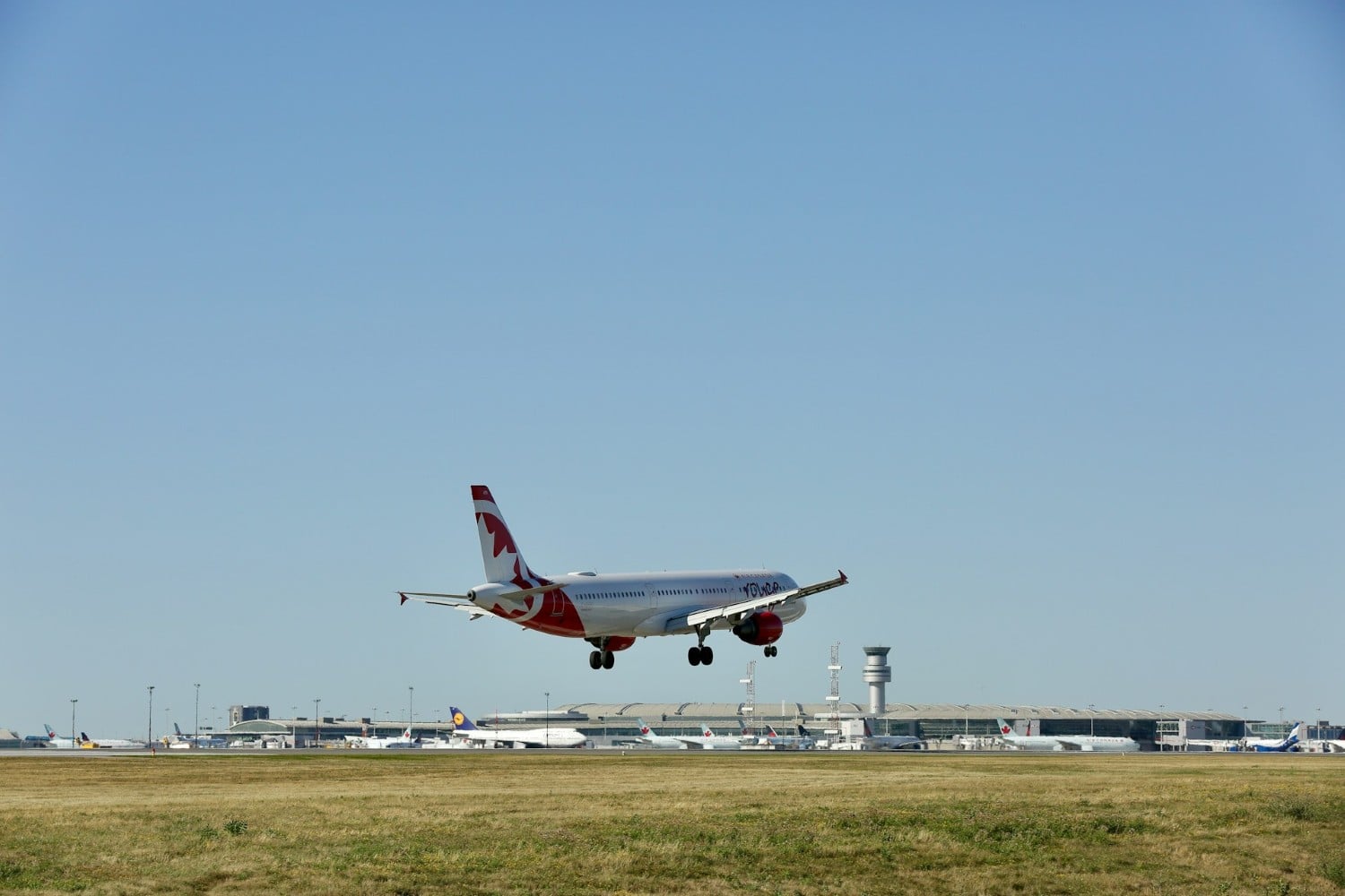 air canada rouge airplane landing at airport