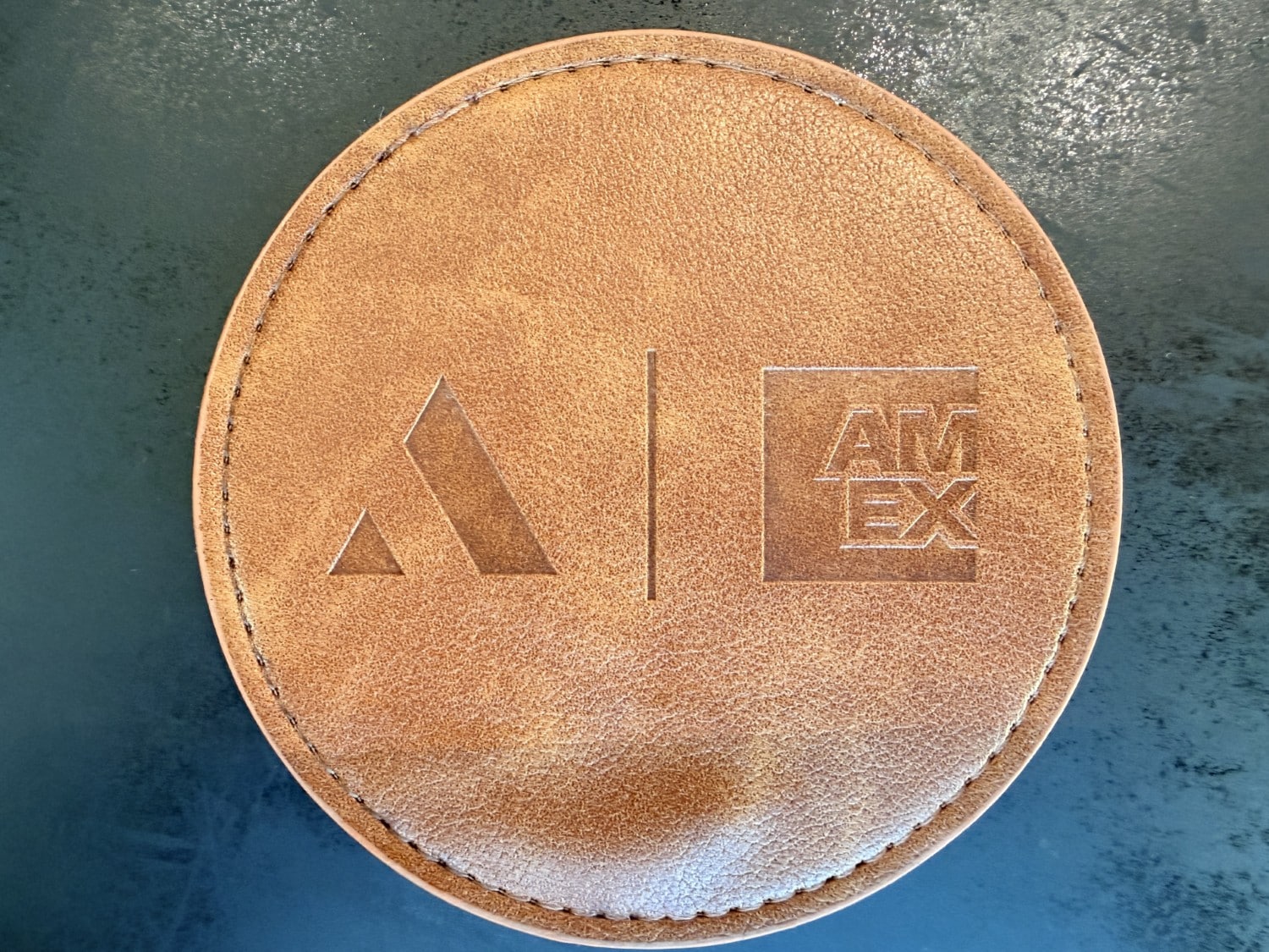 aspire amex lounge montreal yul branded coaster