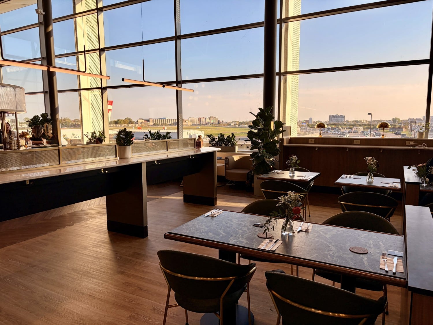 aspire amex lounge montreal yul dining tables with tarmac view