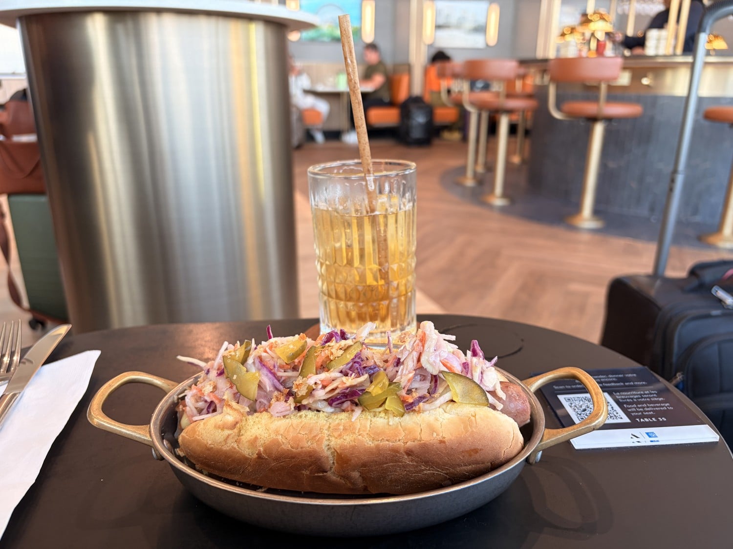 aspire amex lounge montreal yul signature hot dog with drink