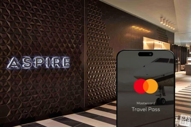 mastercard travel pass program on smartphone outside of airport lounge