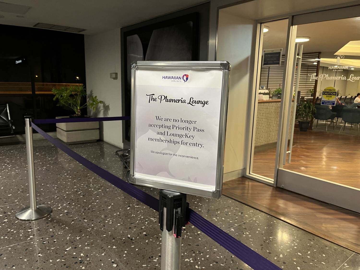 hawaiian airlines plumeria airport lounge sign outside