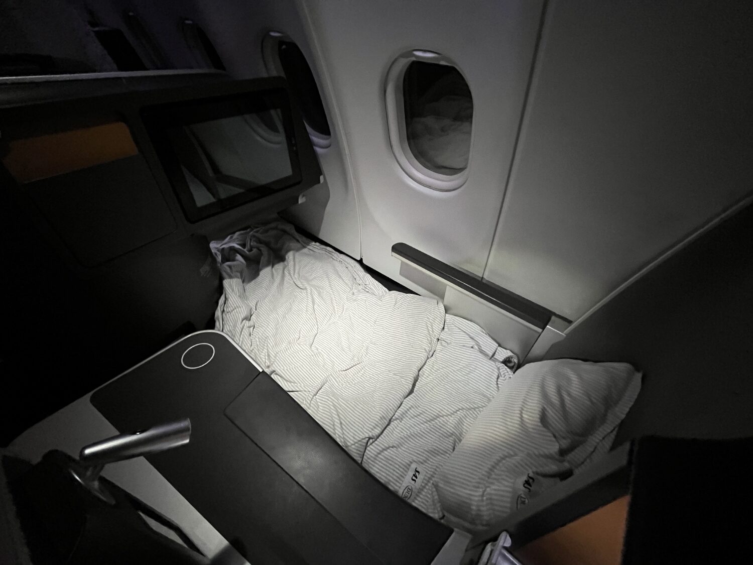 sas business class a330 bed made behind view