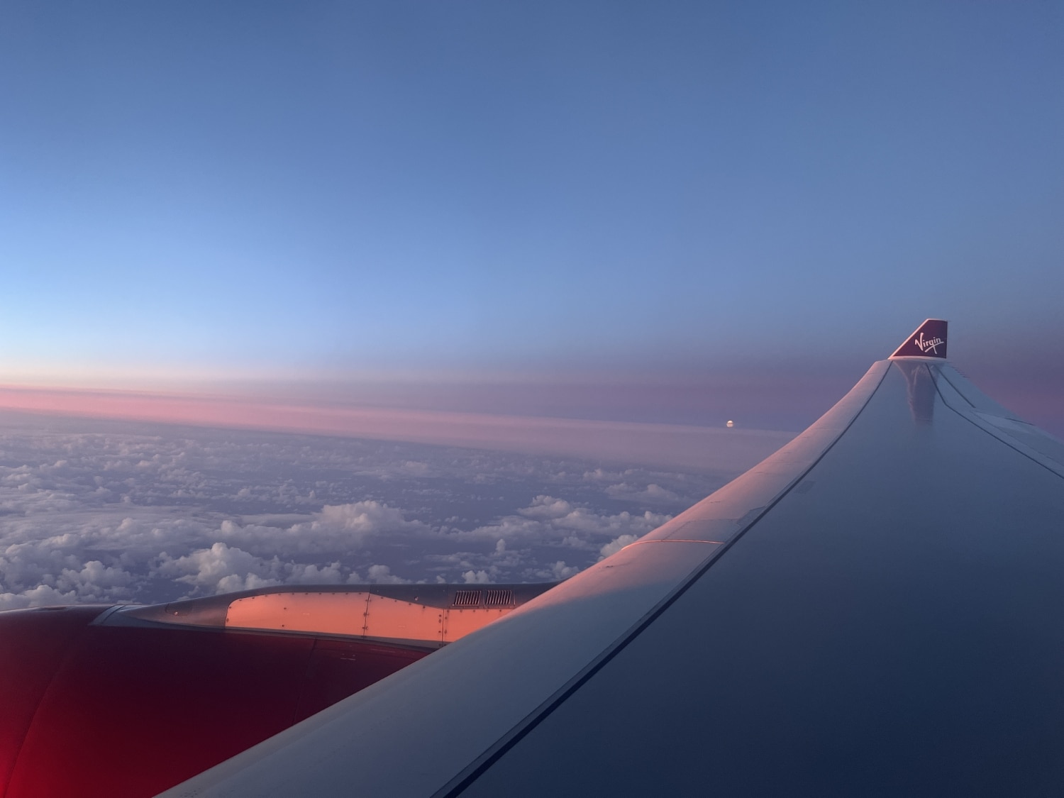 wing of virgin atlantic aircraft mid-flight