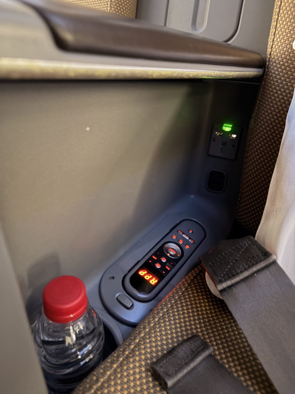 kenya airways business class 787-8 entertainment console remote and power plugs