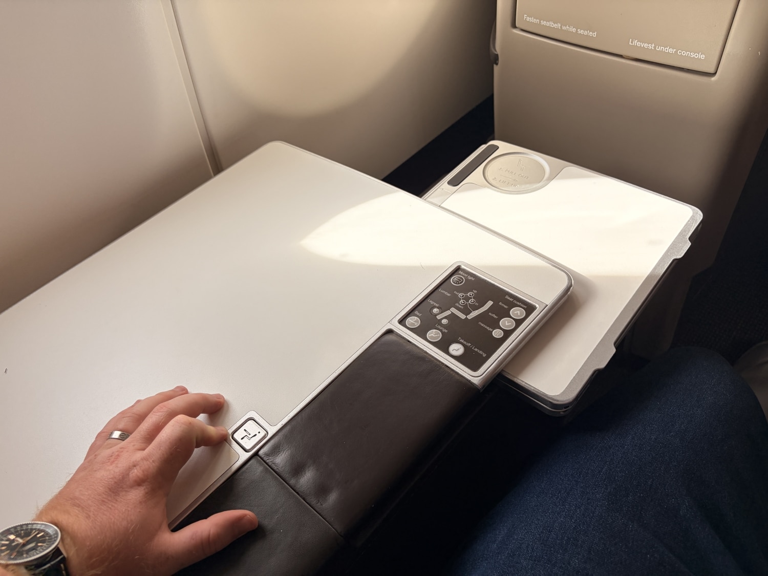 swiss business class a330 tray table partially extended below