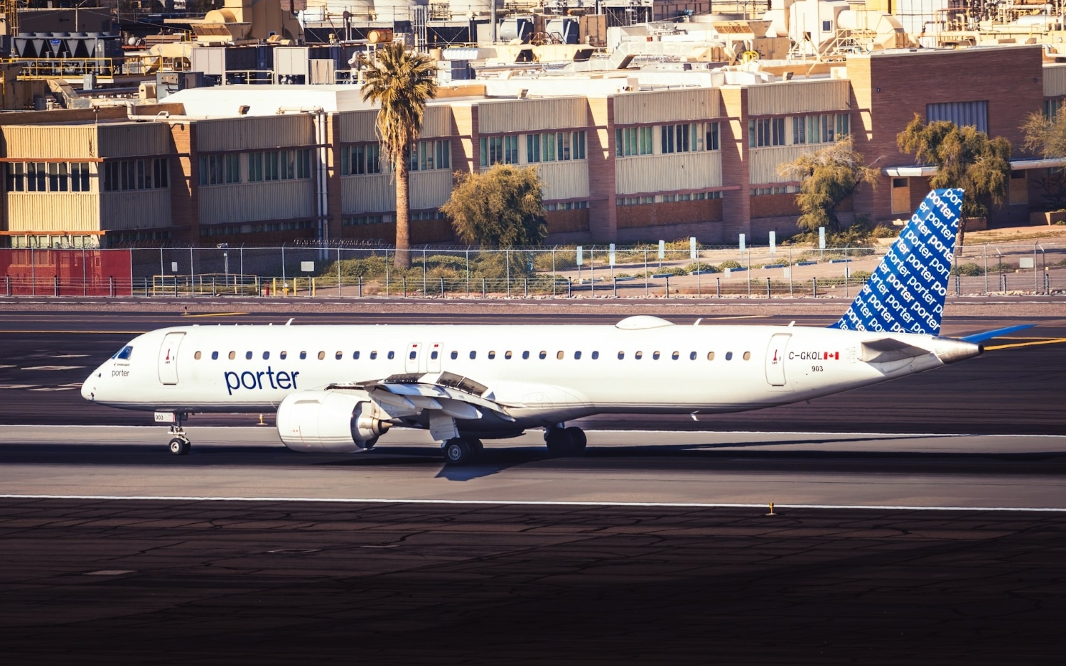 porter airlines aircraft on tarmac in sunny destination