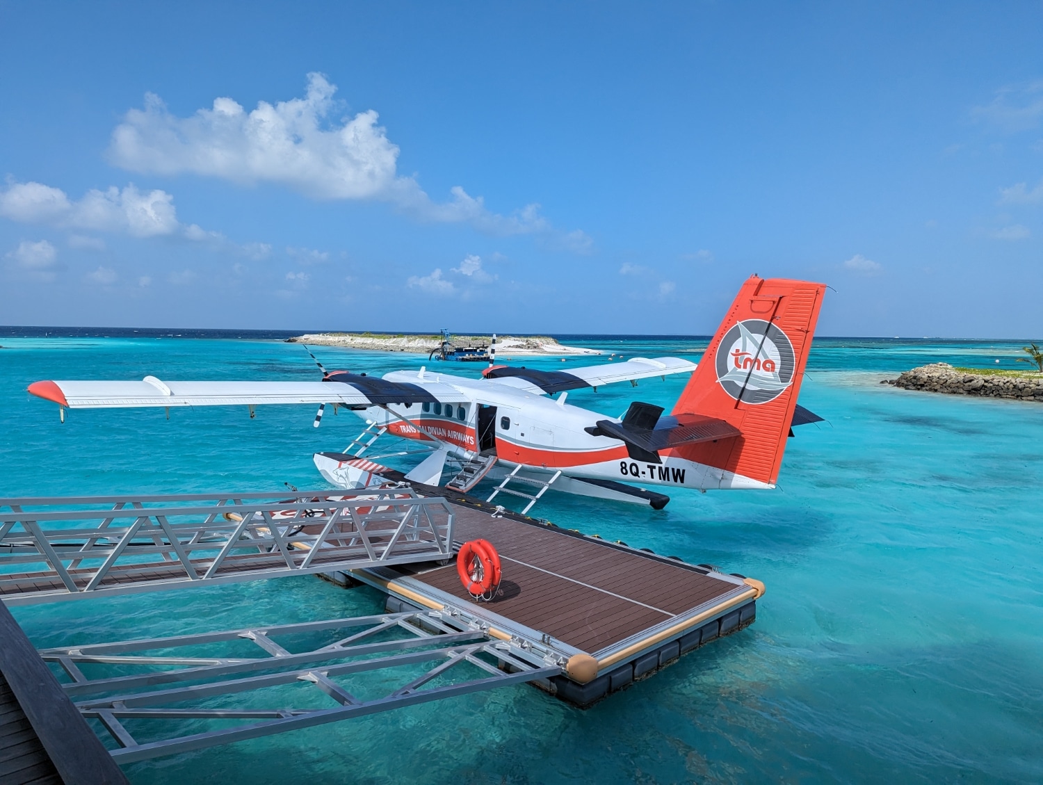 trans maldivian seaplane docked at le meridien maldives