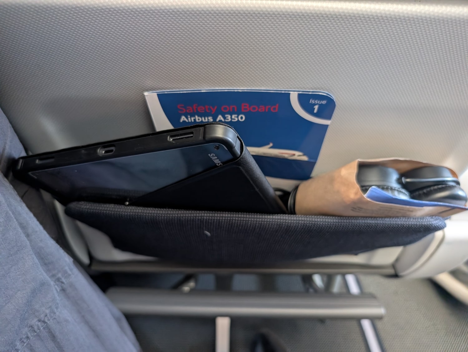 british airways premium economy pocket with tablet stored