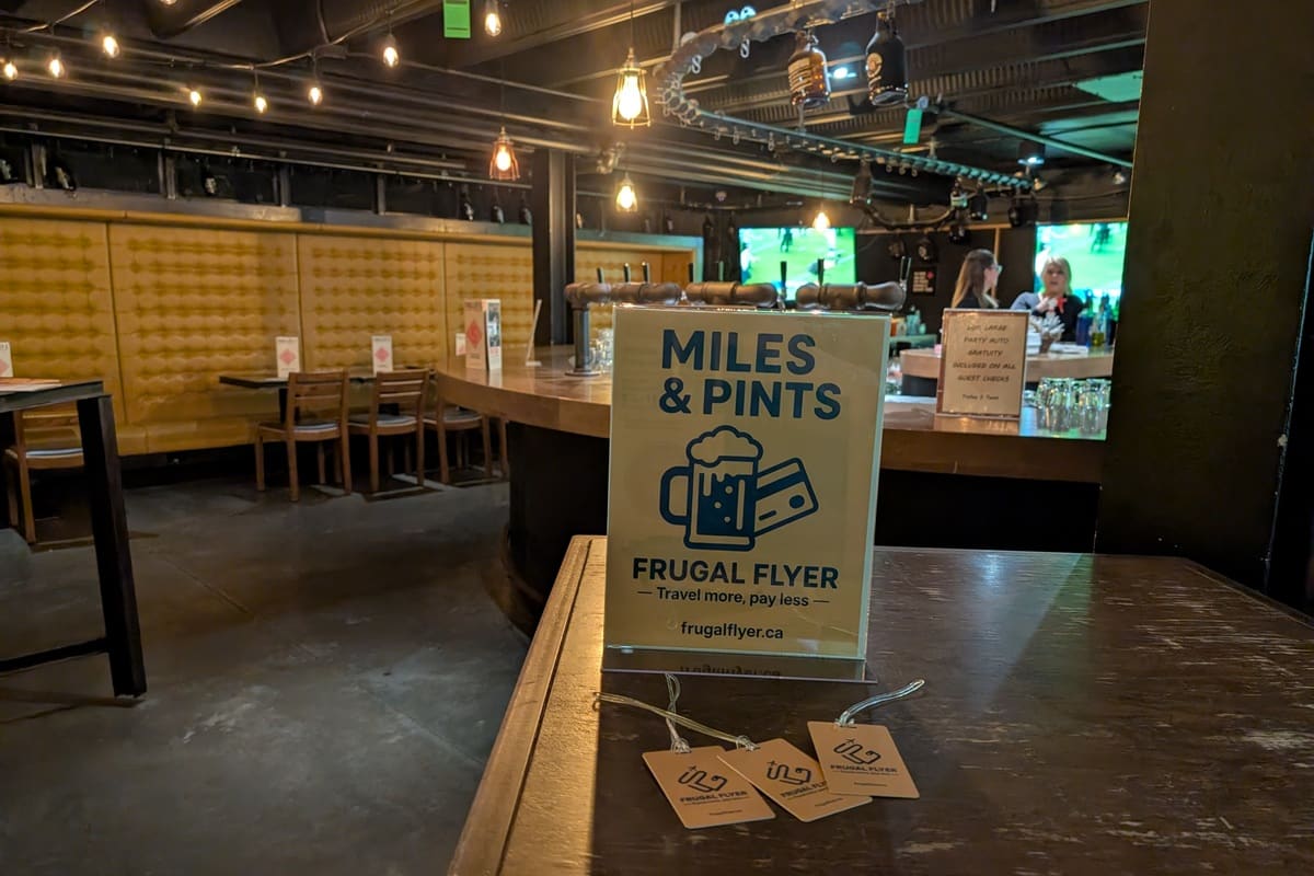 frugal flyer miles and pints event signage with bag tags