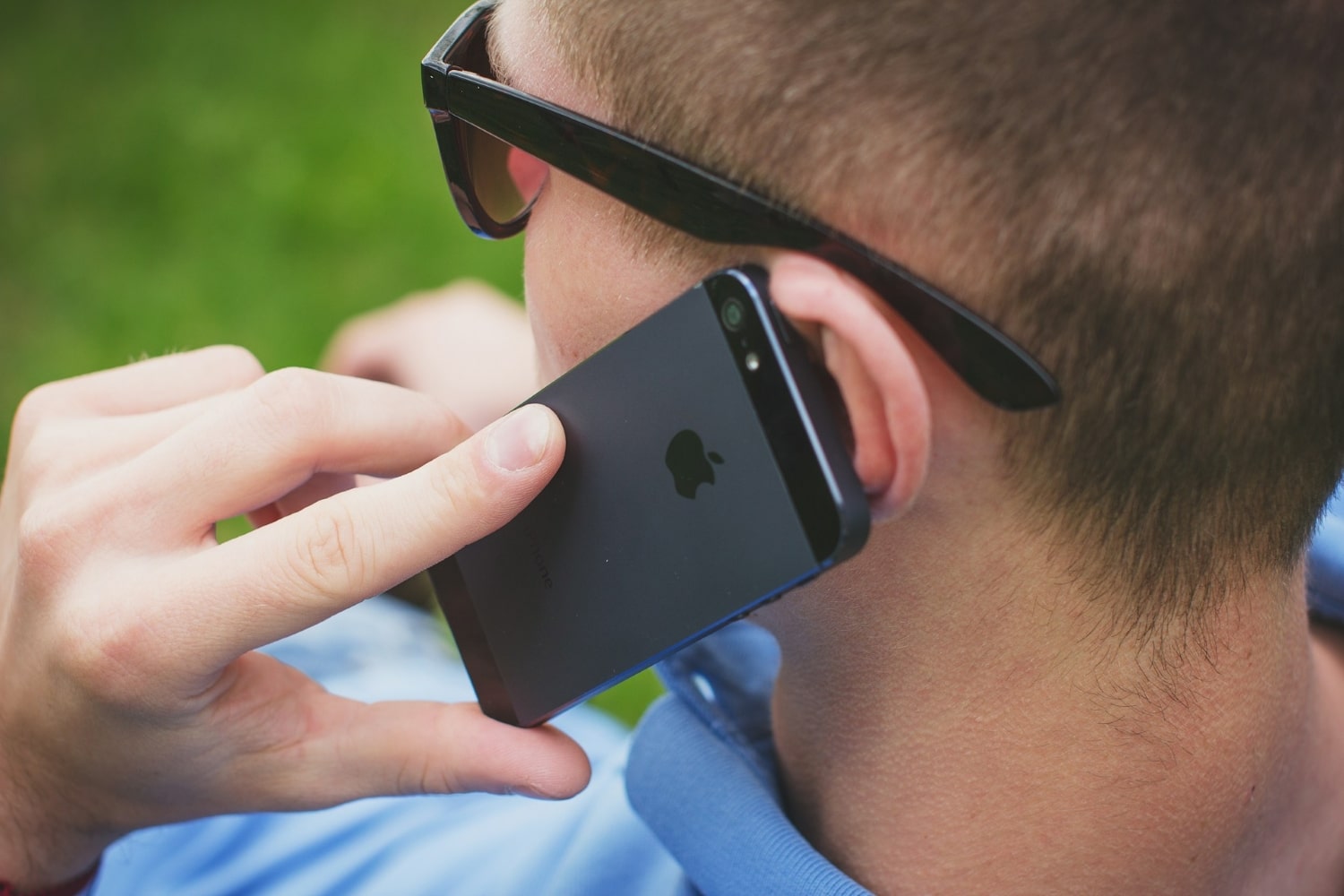 person taking phone call on iphone